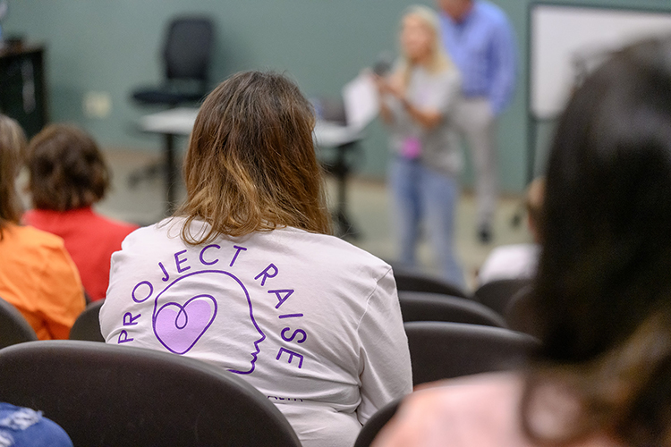 An intern for the Tennessee Department of Education’s Project RAISE listens to a presentation during the full-day summer meeting for project candidates hosted on the Middle Tennessee State University campus at the College of Education Building on July 20, 2023. The state recently brought on MTSU’s Tiffany Wilson, professional school counseling coordinator, to serve as a consultant on the project — the state’s $14 million grant project to retain and recruit mental health professionals into high-needs, rural school districts across the state. (MTSU photo by J. Intintoli)