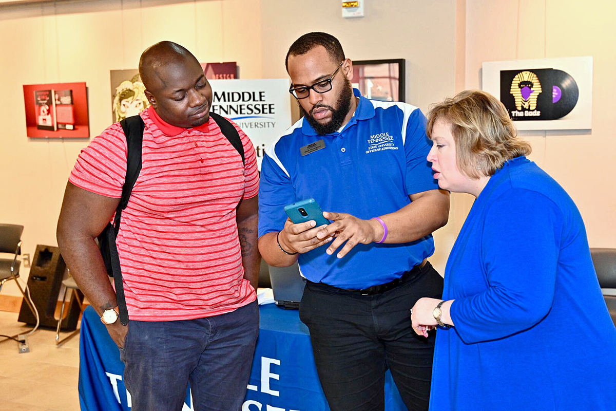 As a Nashville State Community College student in February 2019, Dravidi Pasha, left, receives advice about transferring from MTSU transfer coordinators Zach Thompson and Jeana Nier. Pasha is a senior in the Jones College of Business. The “MTSU Promise Tour runs from Jan. 28 through Feb. 13 at nine community colleges. MTSU takes its “True Blue Pathway” event to Nashville State’s main campus Feb. 4. (MTSU file photo by Andy Heidt)