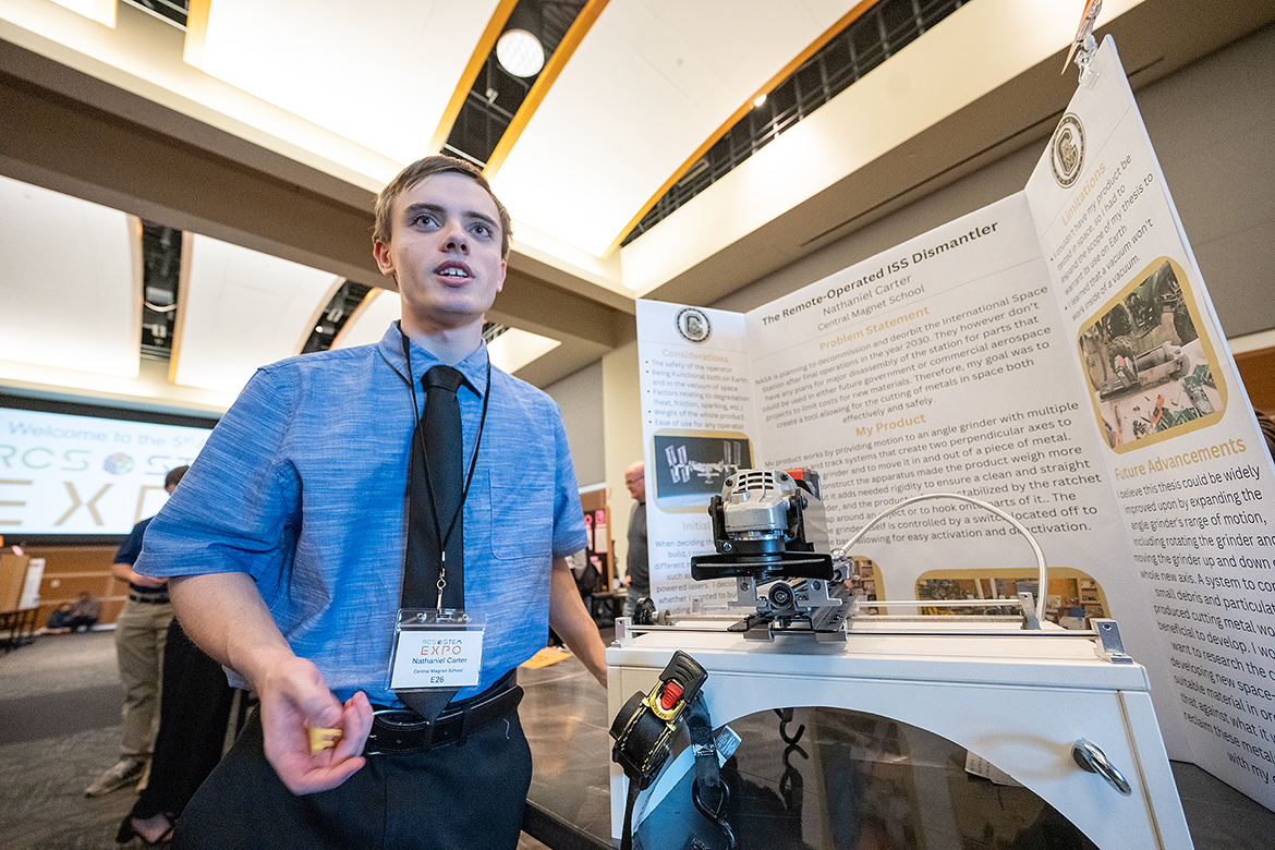 Central Magnet School student Nathaniel Carter explains his STEM project, “The Remote-Operated ISS (International Space Station) Dismantler,” Monday, March 20, in the Middle Tennessee State University Student Union Ballroom. Carter was among 350 students participating in the fifth annual Rutherford County Schools’ STEM Expo. (MTSU photo by Cat Curtis Murphy)