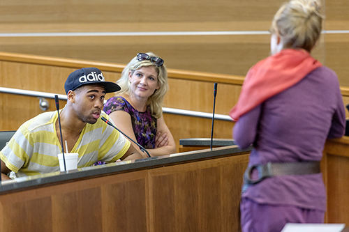 MTSU senior Eugene Lockett, left, asks "Ya-Ya Sisterhood" series author Rebecca Wells, right, a question during Wells' visit to the university Oct. 8 as part of the Tom T. Hall Writers Series. Listening is Abby White, development director for the College of Media and Entertainment.