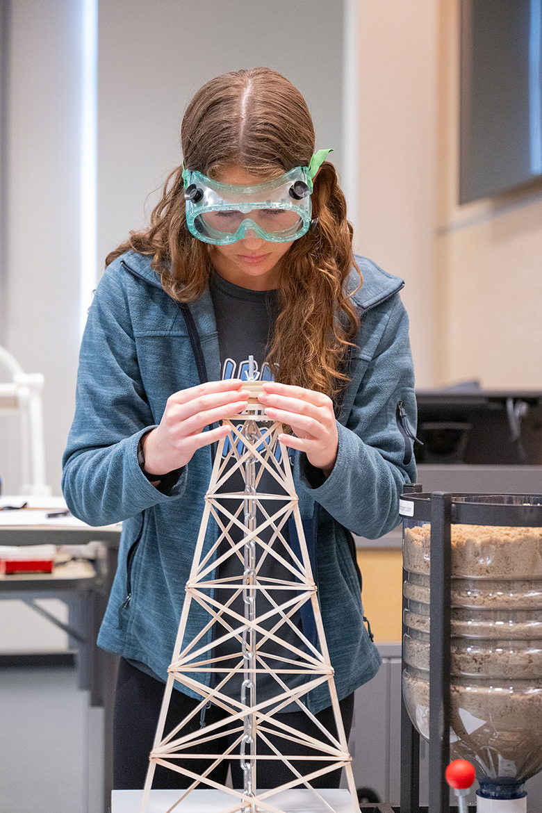 Ella Marlow of Rockvale High School makes an adjustment with her team’s tower in the Tower Event during the 30th annual Regional Science Olympiad at Middle Tennessee State University’s Science Building on campus in Murfreesboro, Tenn., Saturday, Feb. 17. (MTSU photo by Cat Curtis Murphy)