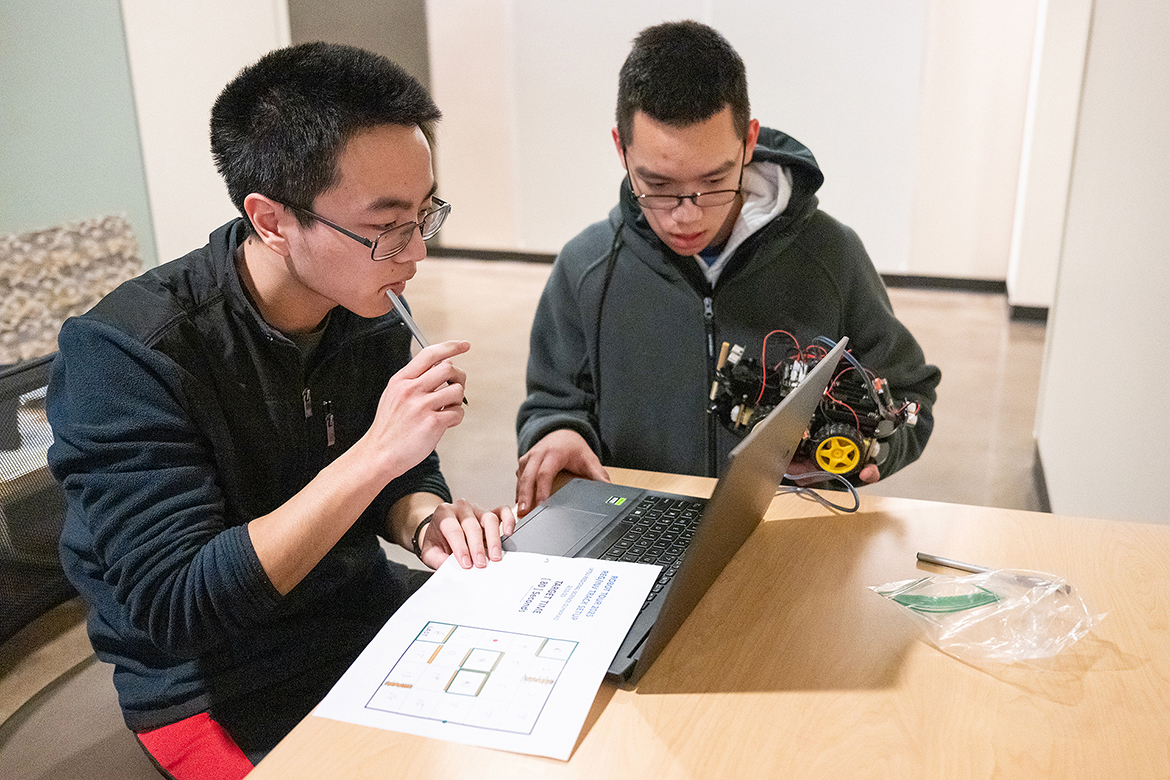 Teammates William Zhong and Thien Nguyen of Hume-Fogg Academic High School in Nashville, Tenn., review instructions in the Robot Tour event Saturday, Feb. 17, during the 30th annual Regional Science Olympiad at Middle Tennessee State University’s Science Building on campus in Murfreesboro, Tenn. (MTSU photo by Cat Curtis Murphy)