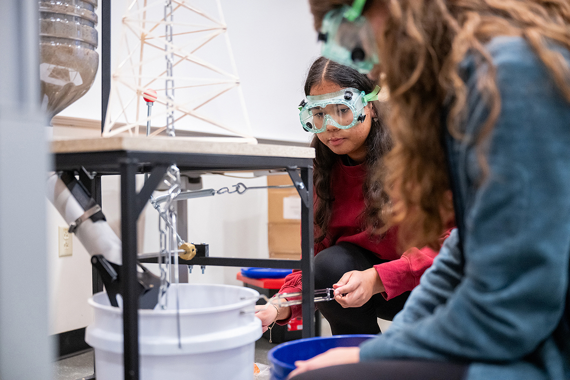 Kaelyn Hicks, left, and Ella Marlow of Rockvale High School compete in the Tower Event Saturday, Feb. 17, in the Science Building on the Middle Tennessee State University campus in Murfreesboro, Tenn., during the 30th annual Regional Science Olympiad. They were among 350 students and 25 teams participating in the middle school and high school divisions. (MTSU photo by Cat Curtis Murphy)