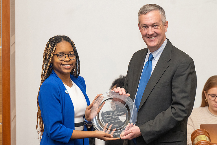 Tennessee Secretary of State Tre Hargett, right, presents Jada Powell, Middle Tennessee State University senior and president of the Student Government Association, with the award for the university’s second win of his College Voter Registration Competition on Thursday, Jan. 26, 2023, at the Student Union Parliamentary Room on campus. (MTSU file photo by Cat Curtis Murphy)