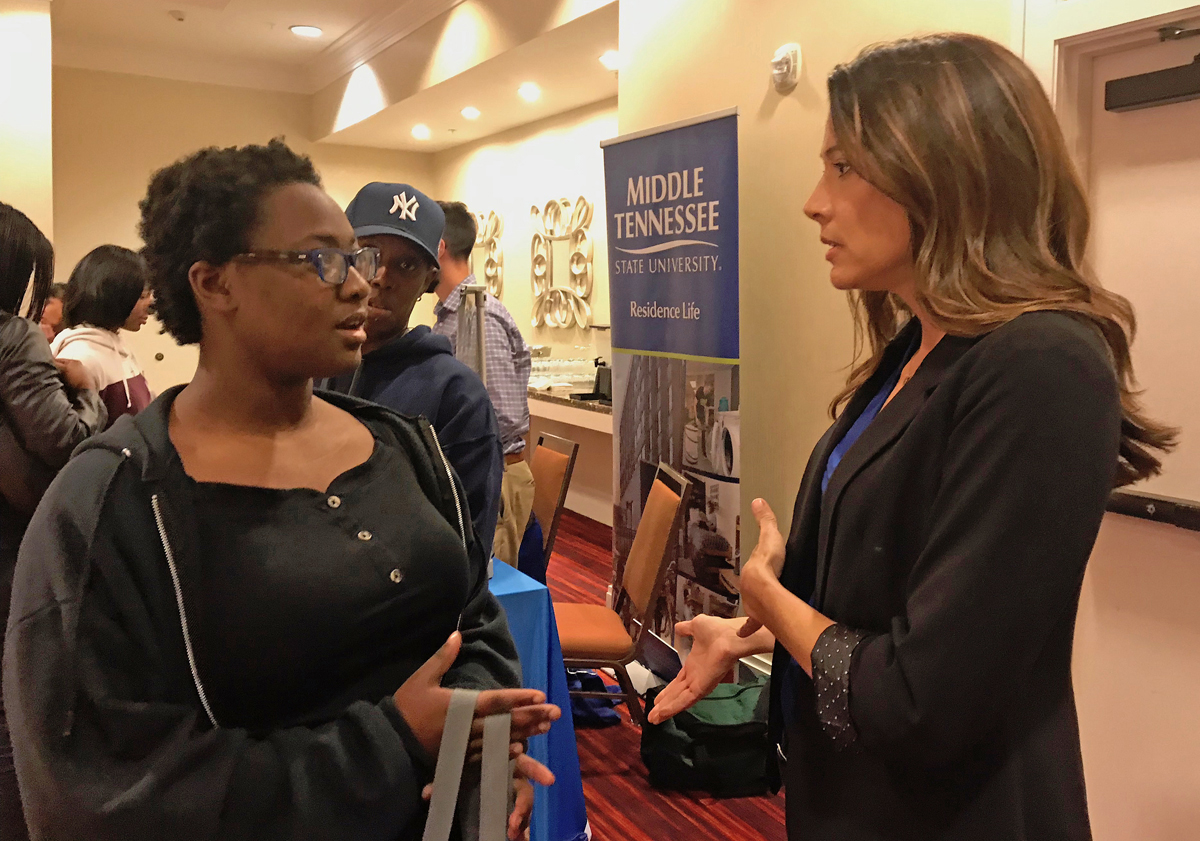 Kierra Phillips, left, a senior at Jeffersontown High School in Louisville, Ky., receives guidance about the MTSU College of Basic and Applied Sciences and has her questions answered by School of Concrete and Construction Management Director Heather Brown Wednesday, Oct. 16, during the annual True Blue Tour visit to recruit students in Louisville. Phillips’ mother, Malissa Phillips, observes. (MTSU photo by Randy Weiler)