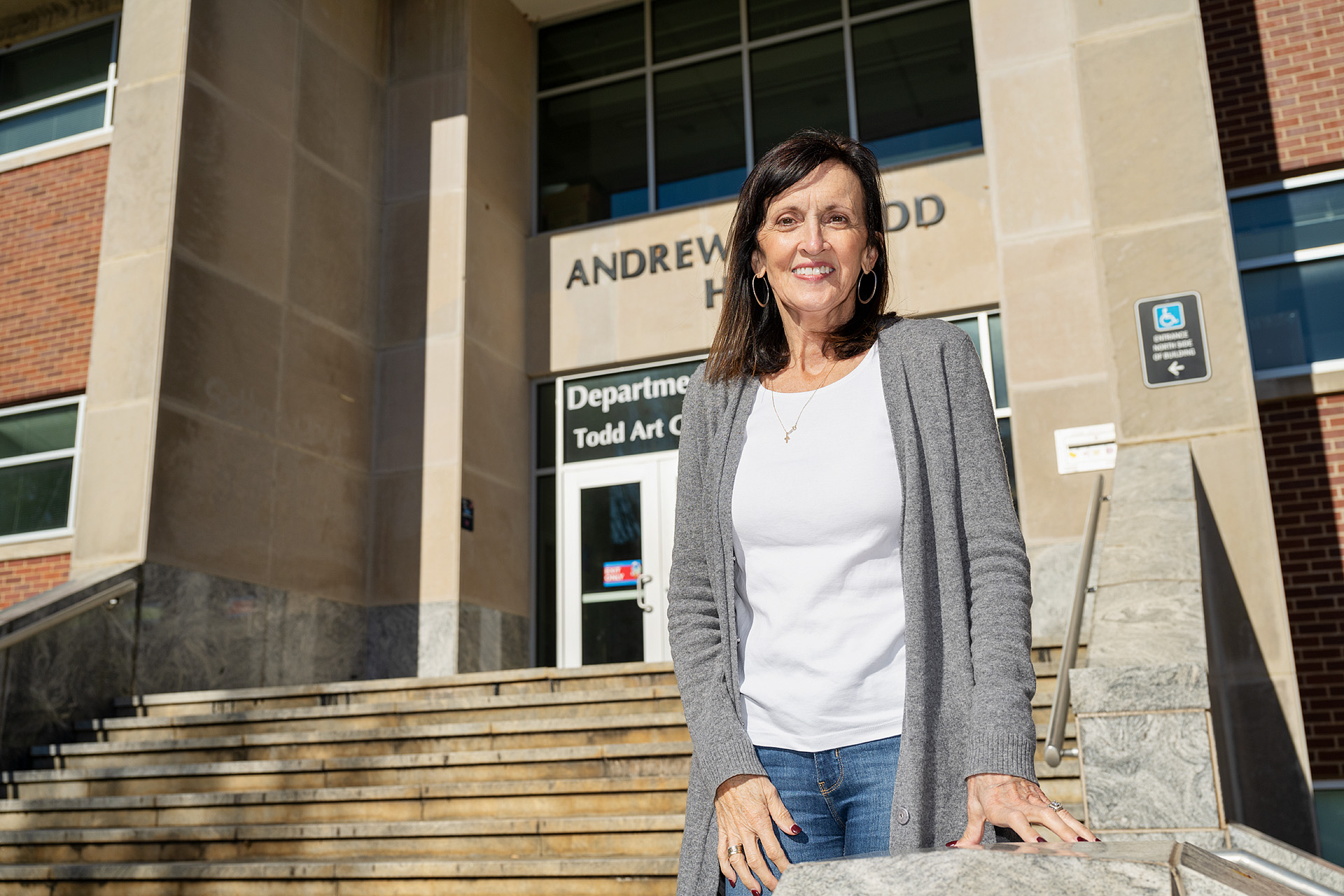 Dr. Lucy Langworthy, assistant to the dean of MTSU's College of Liberal Arts, pauses for a photo outside Todd Hall Thursday, Nov. 19, after checking in on art education students who were inspecting, touching up and adding mosaics to the "Be the Missing Piece" arts and sciences project. The 10 different handcrafted puzzle pieces, now ready for display, are part of a public art project collaboration by the College of Liberal Arts and the College of Basic and Applied Sciences to show students the interdisciplinary core skills they need for success. (MTSU photo by Andy Heidt)