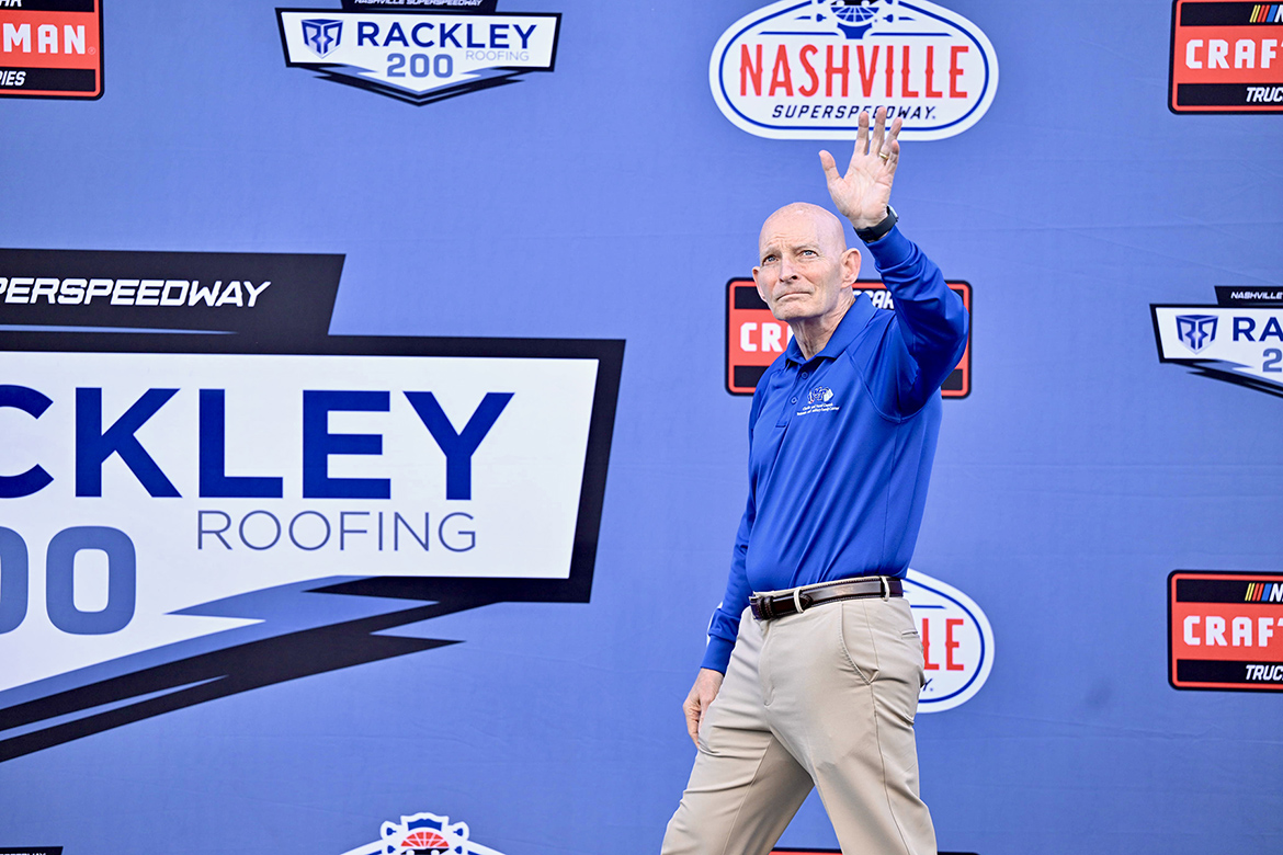 Retired Lt. Gen. Keith Huber, senior adviser for veterans and leadership initiatives at Middle Tennessee State University in Murfreesboro, Tenn., waves to NASCAR fans during his appearance as the honorary track official at the May 30 Rackley Roofing 200 at Nashville Superspeedway in Lebanon, Tenn. (MTSU photo by James Cessna)