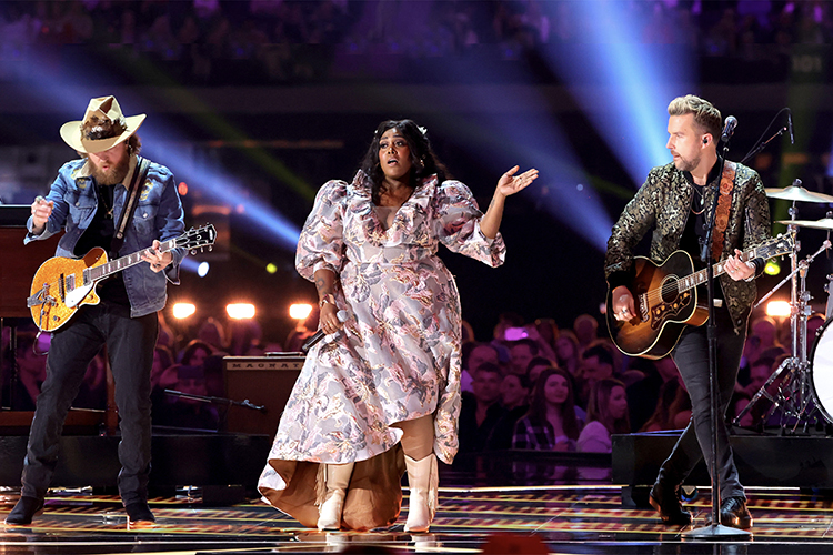 MTSU alumna Brittney Spencer, center, performs with "These Boots Are Made For Walkin'" with John, left, and T.J. Osborne of Brothers Osborne onstage during the 57th Academy of Country Music Awards at Allegiant Stadium March 7 in Las Vegas. (photo by Kevin Winter/Getty Images for ACM)