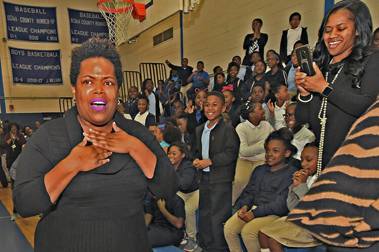 MTSU alumna Erica Stephens (Class of ’02) is shocked as she is announced at an all-school assembly as a winner of the prestigious Milken Educator Award, a national honor that comes with a $25,000 financial prize. Stephens is a fourth-grade math teacher at John P. Freeman Optional School in Memphis, Tenn. (Photo courtesy of the Milken Family Foundation)
