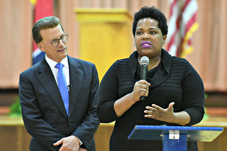 MTSU alumna Erica Stephens (Class of ’02) speaks to an all-school assembly after she was announced as a winner of the prestigious Milken Educator Award, a national honor that comes with a $25,000 financial prize. Stephens is a fourth-grade math teacher at John P. Freeman Optional School in Memphis, Tenn. At left is Milken Family Foundation Chairman and co-Founder Lowell Milken. (Photo courtesy of the Milken Family Foundation)