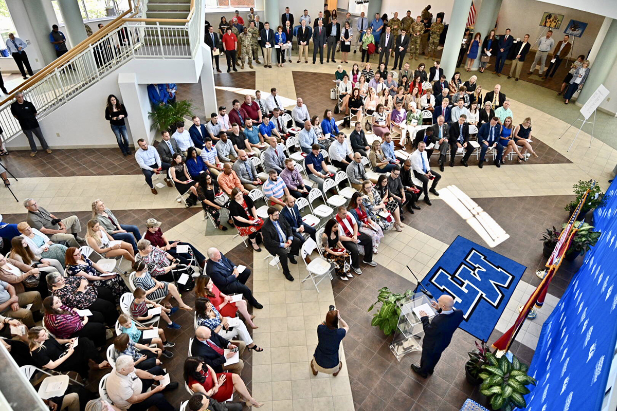 A standing-room-only crowd listens as Keith M. Huber, senior adviser for veterans and leadership initiatives and a retired U.S. Army lieutenant general, shares the importance of recognizing graduating veterans during the special ceremony held before commencement. MTSU’s Daniels Veterans Center recognized nearly 50 senior veterans Thursday, April 24, in the Miller Education Center. 