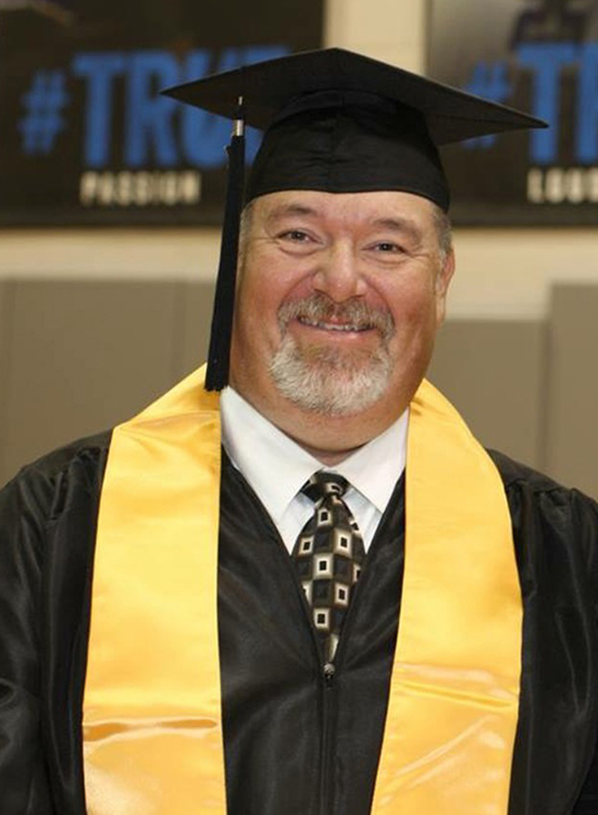 Emergency medical technician Scott Storey of Mt. Pleasant, Tenn., readies for his commencement ceremony inside Murphy Center at Middle Tennessee State University. Storey graduated in 2017 with a bachelor’s degree in professional studies through MTSU Online. (Submitted photo)