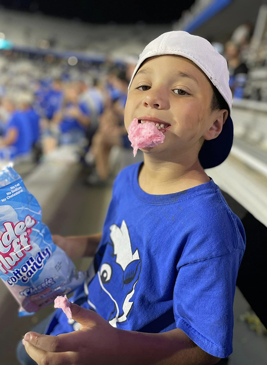 In this undated photo, Ben Storey, the youngest son of MTSU alumnus and EMT Scott Storey (Class of 2017) of Mount Pleasant, Tenn., enjoys a treat during a Blue Raider football game at Floyd Stadium. Storey’s father earned his bachelor’s degree in professional studies through MTSU Online. (Submitted photo)