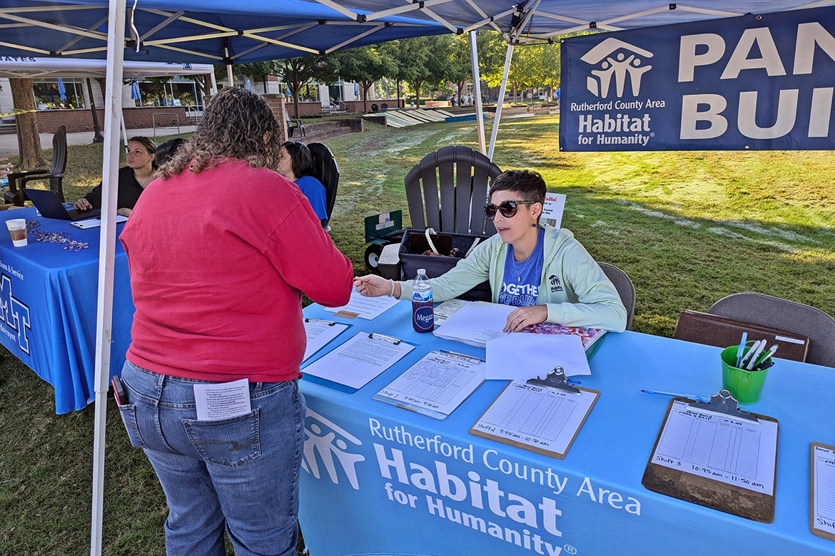 A volunteer checks into her timeslot for the Habitat for Humanity panel build on Thursday, Oct. 3, in the Student Union Commons in Murfreesboro, Tenn. (Photo courtesy of Rutherford County Area Habitat for Humanity)