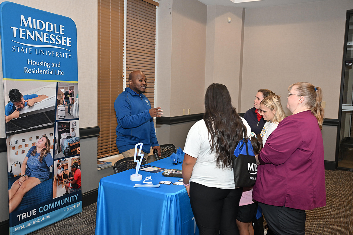 Alonzo Bouldin, left, assistant director of operations for Housing and Residential Life at Middle Tennessee State University in Murfreesboro, Tenn., shares information with attendees during MTSU’s True Blue Tour student recruitment stop on Thursday, Sept. 18, at the Leslie Town Centre in Cookeville, Tenn. (MTSU photo by James Cessna)