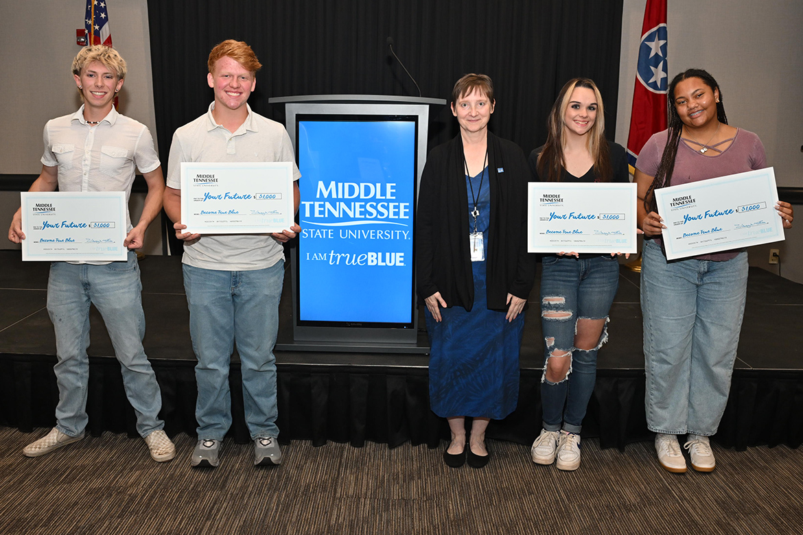 Laurie Witherow, third from right, vice provost for Enrollment Management at Middle Tennessee State University in Murfreesboro, Tenn., poses with student scholarship winners at MTSU’s True Blue Tour student recruitment stop on Thursday, Sept. 18, at the Leslie Town Centre in Cookeville, Tenn. Pictured, from left, are prospective students Travis Wiggins, Solomon Hawkins, Witherow, Jessica Gentry, and Simone Savage. (MTSU photo by James Cessna)