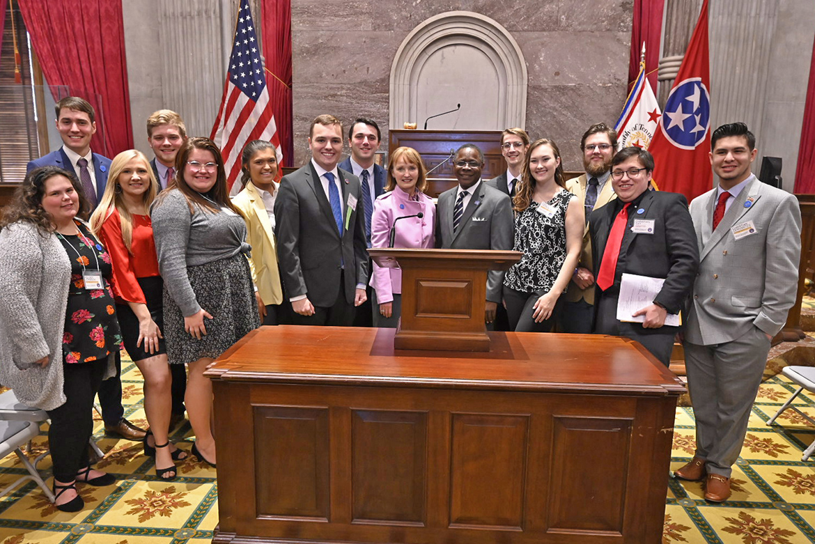 MTSU President Sidney A. McPhee, center right, and former House Speaker Beth Harwell, now a distinguished visiting professor at MTSU, meet on the State Capitol House chamber floor Thursday, Nov. 21, with members of MTSU’s delegation to the Tennessee Intercollegiate State Legislature. (MTSU photo by Andrew Oppmann)