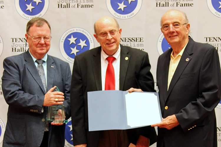 Earl Freudenberg, veteran Chattanooga, Tenn., radio and television broadcaster, receives his award and certificate during the induction ceremony for the 2019 class of the Tennessee Journalism Hall of Fame held Tuesday, Aug. 6, at Embassy Suites in Murfreesboro, Tenn. Shown with him are Hooper Penuel, right, TJHOF co-founder and secretary, and TJHOF President Larry Burriss. (Submitted photo)