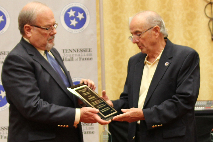 Tennessee Journalism Hall of Fame co-founder and secretary Hooper Penuel, right, presents Ron Fryar, owner and publisher of the Cannon Courier, with a special plaque in memory of hall co-founder and 2018 Dan Whittle, a friend of both of died in April after a long battle with leukemia. The 2019 class was inducted during a special ceremony held Tuesday, Aug. 6, at Embassy Suites in Murfreesboro, Tenn. (Submitted photo)