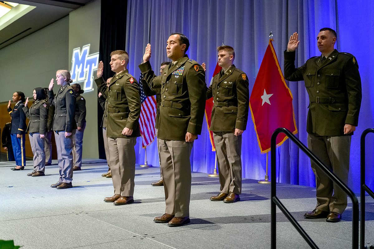 Eleven of the U.S. Army’s newest commissioned second lieutenants take the Army Oath, administered by Lt. Col. Carrick McCarthy, an MTSU military science professor who leads the program, Friday, May 7, during the Spring Commissioning Ceremony in the Student Union Ballroom. (MTSU photo by J. Intintoli)