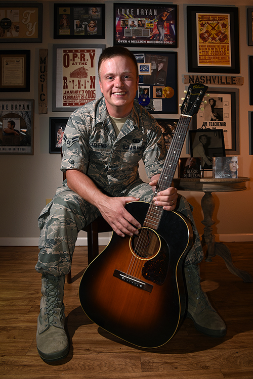 Airman 1st Class Jamie Teachenor, U.S. Air Force Academy Band and Wild Blue Country lead vocalist, displays his gold and platinum records and other music memorabilia in his home at Peterson Air Force Base, Colo., on July 20, 2016. Teachenor wrote numerous chart-topping songs for some of the most recognizable names in the country music world, including Blake Shelton, Vince Gill, Luke Bryan, Trace Adkins, Montgomery Gentry, Trisha Yearwood, Gretchen Wilson, Blaine Larsen and many more. (U.S. Air Force photo by Airman 1st Class Dennis Hoffman)