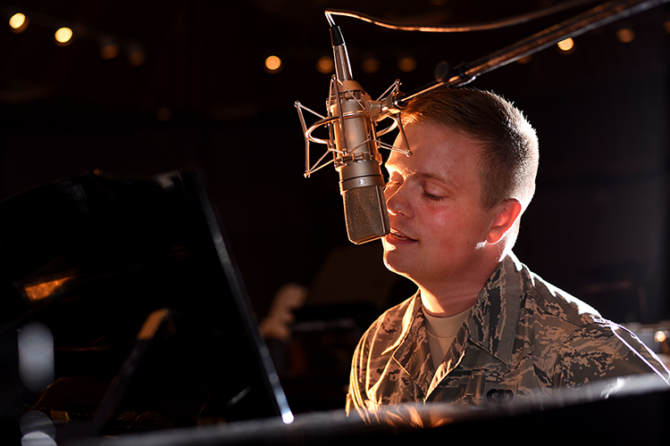 Airman 1st Class Jamie Teachenor, U.S. Air Force Academy Band and Wild Blue Country lead vocalist, rehearses his songs at Peterson Air Force Base, Colo., on July 20, 2016. Before joining the Air Force, Teachenor was a multi-platinum singer and songwriter based in Nashville, Tenn. (U.S. Air Force photo by Airman 1st Class Dennis Hoffman)