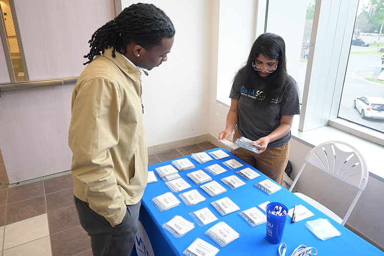 A Middle Tennessee State University student checks in at the 2025 Tech Vision Conference on April 10 in the Miller Education Center atrium on Bell Street on the MTSU campus in Murfreesboro, Tenn. (MTSU photo by Jimmy Hart) 16 – Attendees gather for a session at the 2025 Tech Vision Conference on April 10 in the Miller Education Center atrium on Bell Street on the Middle Tennessee State University campus in Murfreesboro, Tenn. (MTSU photo by Jimmy Hart)