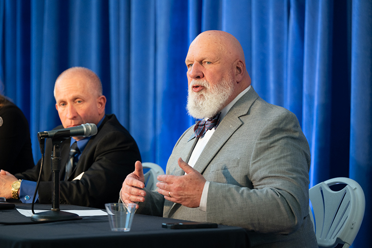 Thom Coats, right, professor of practice and director for the MTSU Center for Professional Selling at Middle Tennessee State University, gives remarks during a panel of university center directors at the 2025 Tech Vision Conference held April 10-11 in the Miller Education Center atrium on Bell Street on the MTSU campus in Murfreesboro, Tenn. At left is fellow panelist Richard Tarpey, director, Center for Supply Chain Management and Sustainability. (MTSU photo by James Cessna)