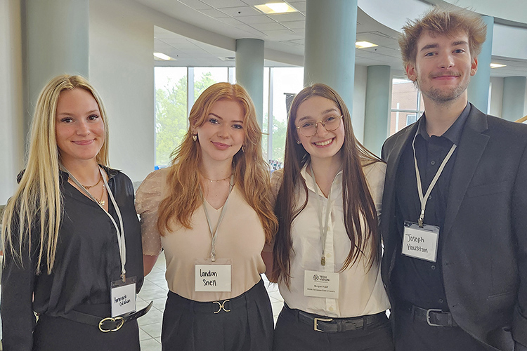 From left, Middle Tennessee State University students Annmarie Calahan, London Snell, Morgan Rueff and Joseph Houston attend the keynote luncheon session at the 2025 Tech Vision Conference on April 10 in the Miller Education Center atrium on Bell Street on the Middle Tennessee State University campus in Murfreesboro, Tenn. (MTSU photo by Jimmy Hart)