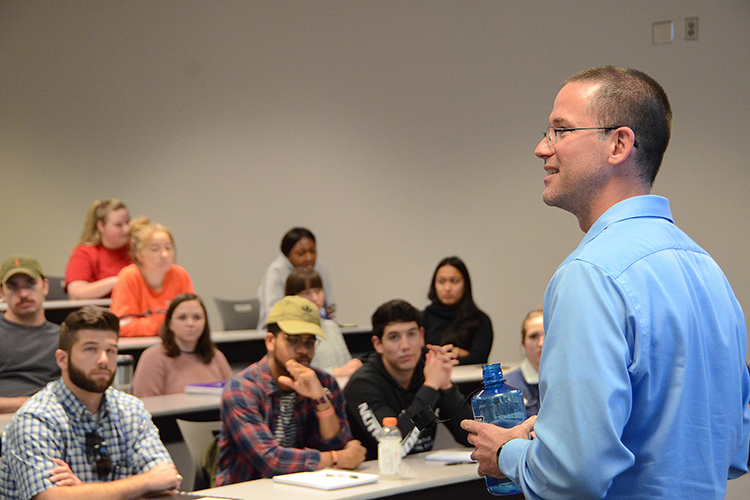 Social entrepreneur and author Matt Tenney talks to MTSU management students about the value of servant leadership during a guest lecture Thursday, Oct. 17, inside the Business and Aerospace Building classroom. (MTSU photo by Jimmy Hart)