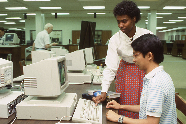 Library employee Melanie Thomas assists a student in the Todd Library’s CD-ROM center in this 1987 file photo. (Photo submitted)