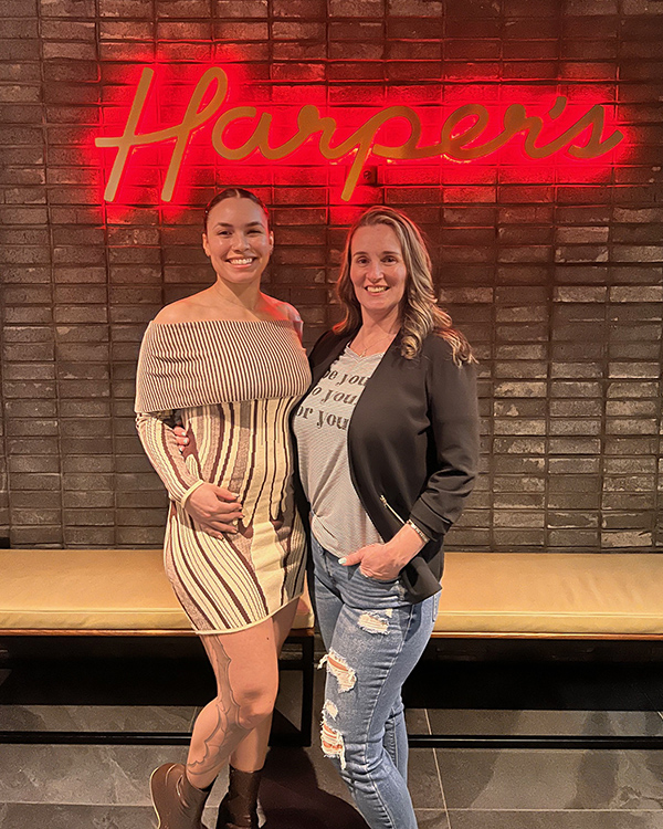 Middle Tennessee State University nontraditional student Toscha McClain, right, poses with her daughter and MTSU alumna Tre'ce at Harper’s steakhouse in Nashville, Tenn., in this undated photo. McClain said her daughter earning her degree in 2020 inspired her to enroll at MTSU, where she is set to earn her professional studies degree this fall. (Submitted photo)