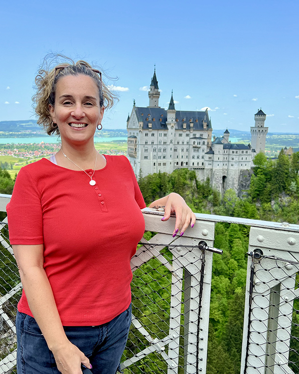Middle Tennessee State University nontraditional student Toscha McClain is shown here during a summer 2023 MTSU study abroad trip to Germany with the 19th century Neuschwanstein Castle in the background. McClain said her daughter earning her degree in 2020 inspired her to enroll at MTSU, where she is set to earn her professional studies degree this fall. (Submitted photo)
