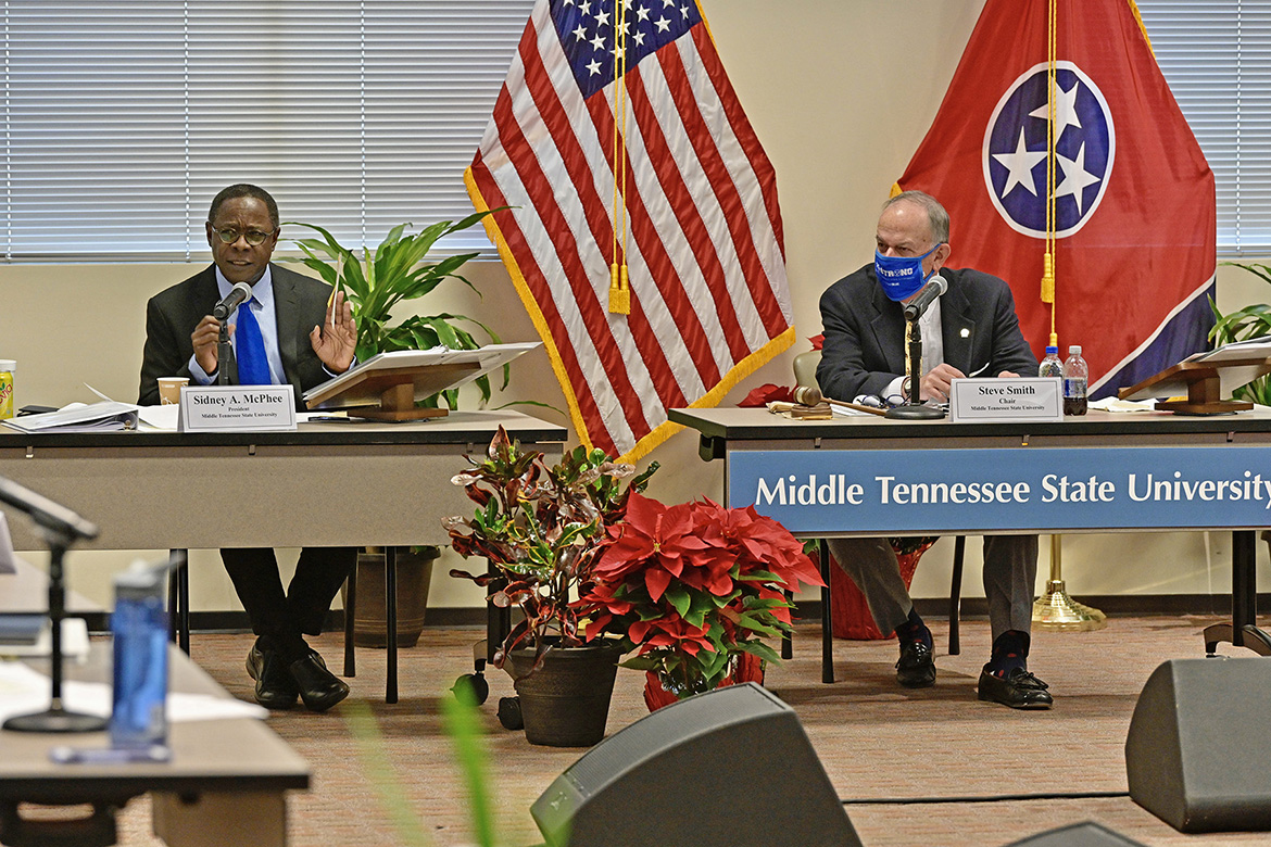 MTSU President Sidney A. McPhee, left, gives his report to the Board of Trustees during its meeting held Tuesday, Dec. 8, 2020, inside the Miller Education Center. At right is Board Chairman Stephen Smith. (MTSU photo by Andy Heidt)