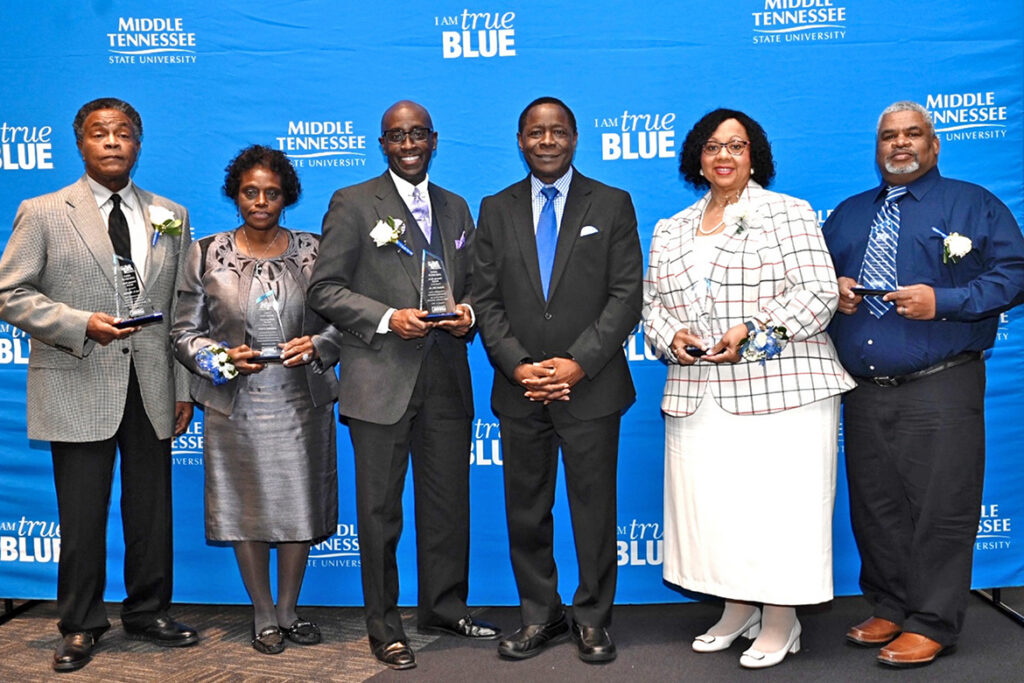 "Unsung heroes" of the Black community were honored for their lifelong achievements in five categories at the 26th annual Unity Luncheon Feb. 10 at MTSU. From L, Carl E. Watkins, Advocate of Civility; Melbra Simmons, Community Service; Robert Orr Jr., Contribution to Black Arts; MTSU President Sidney A. McPhee; Elma Black McKnight, Education; and Thomas Keith, Excellence in Sports. (MTSU photo by J. Intintoli)