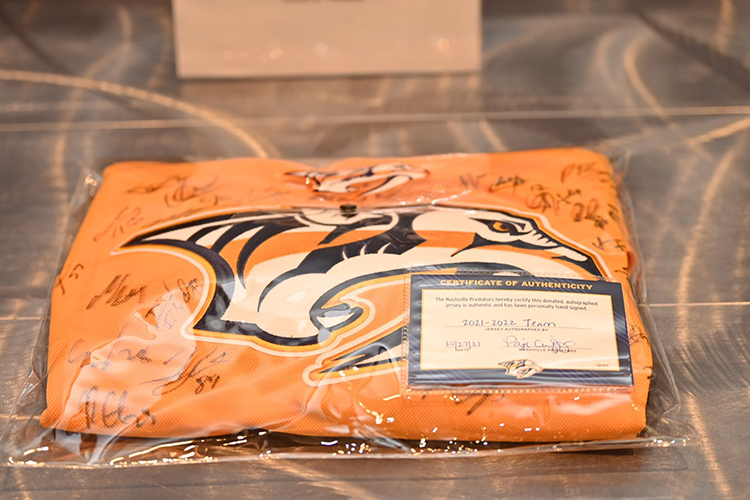 This team-signed Nashville Predators jersey was among the auction items available Tuesday, Nov. 2, at the fourth annual Veteran Impact Celebration held at the Student Union Ballroom on the Middle Tennessee State University campus. The Predators were a presenting sponsor for the event, with proceeds benefitting MTSU’s Charlie and Hazel Daniels Veterans and Military Family Center. (MTSU photo by James Cessna)