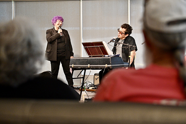 WMOT Roots Radio 89.5 host Jessie Scott, left, chats with indie-folk artist A.J. Croce during his live set at the radio station’s 50th anniversary celebration held Tuesday, April 9, at the Cyber Cafe on the MTSU campus. (MTSU photo by J. Intintoli)