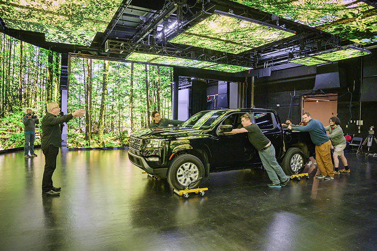 David Bennett, vice president of business development at Monolith Studios, guides MTSU media students during production for a "teaser" commercial in Nashville for the Department of Media Arts' new extended reality, or XR, stage, a new type of film and video production stage that will enable them to create projects anywhere, anytime. Monolith Studios has advised MTSU on its new setup for its XR facility, the only one of its kind at a Tennessee university, which will be ready for classes this fall. (MTSU photo by Andy Heidt)