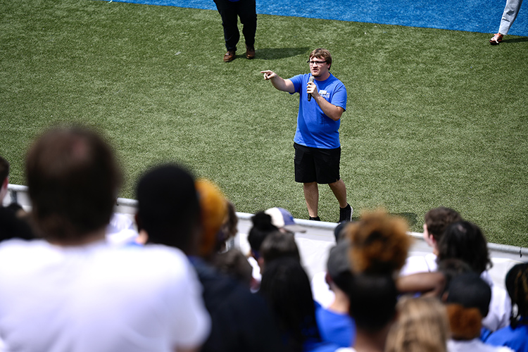 Blue Zoo Vice President Coby Marlow gives instructions to about 300 students from the Office of Student Success’s Scholars Academy and STAR early arrival programs about how to unfurl the Blue Zoo banner for the first time this academic year in the student section inside Floyd Stadium Wednesday, Aug. 17. (MTSU photo by J. Intintoli)