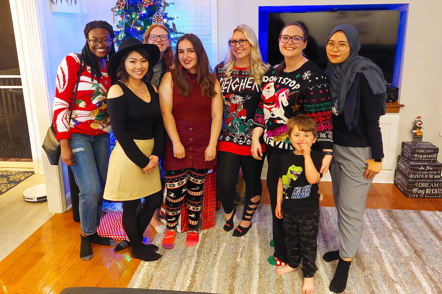 Biology education researchers and students from Middle Tennessee State University’s Social Perceptions of Science lab research the public’s attitudes toward controversial science topics. A few of these lab members, some of them pictured here celebrating at a holiday party in winter 2021, recently completed innovative research about effective COVID-19 communication. Standing, from left, are Chloe Bowen, Thipphaphone Niravong, Madeline Aadnes, Mariana de Araujo Bryan, Alexa Summersill, biology professor and head of the lab Liz Barnes, Barnes’ son, Owen Jackson, and Rahmi Aini. (Photo courtesy of Liz Barnes)