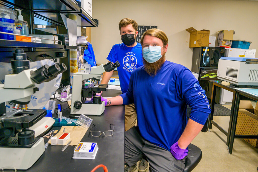 Cole Easson, Middle Tennessee State University research assistant professor, left, works in the lab with MTSU graduate biology student Jeremy Smith in the MTSU Science Building on Sept. 27, 2021. Easson earned a National Science Foundation grant, which funds his marine sponge research project and opens research opportunities for MTSU students. (MTSU photo by Andy Heidt)