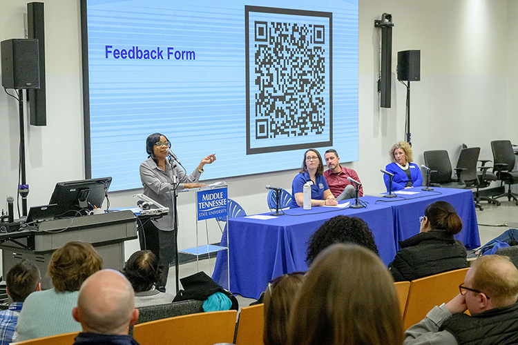 Middle Tennessee State University public health professor Chandra Story, left, speaks to faculty, staff and students who attended a Wednesday, March 5, town hall to discuss the university’s new Quality Enhancement Plan, or QEP, called “Career EDGE” built around the concept of career readiness. Seated up front, from left, are QEP committee members and faculty, Jenna Gray-Hildenbrand, Grant Gardner and Shannon Harmon. Story, who serves as the QEP director, asked for feedback during the town hall, which was held in Room 105 of the School of Concrete and Construction Management Building on the MTSU campus in Murfreesboro, Tenn. (MTSU photo by J. Intintoli)