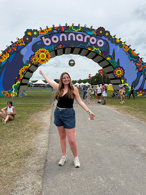 Ella Cobb stands in front of the Bonnaroo Arts and Music Festival at the Manchester, Tenn. farm on June 12, 2025. (Photo submitted)