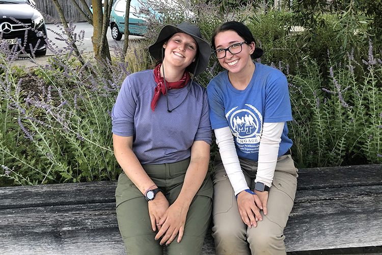 Audrey Lauerhass, Middle Tennessee State University forensic science and anthropology student, left, poses with MTSU student Tori Bascou, both in their field clothes after a long day of work on a recovery site in France as part of the MTSU Forensic Aviation Archaeology study abroad course in summer 2022. (Photo courtesy of Audrey Lauerhass)