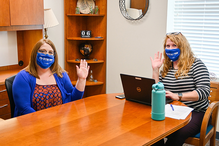 Allison Martenson, left, business process specialist, and Lyndsey Bennett, right, senior graduate analyst, share lunch and a wave at the MTSU College of Graduate Studies on Oct. 15, 2020. (MTSU photo by Stephanie Barrette)