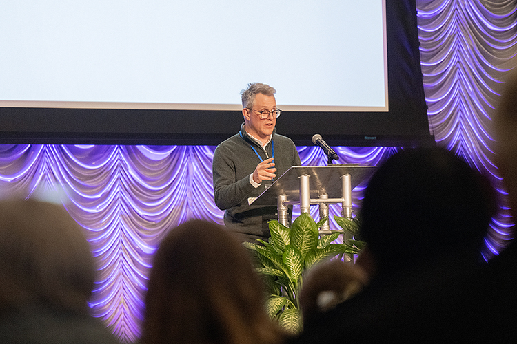 Keynote speaker Daniel H. Magilow, a professor of German at the University of Tennessee-Knoxville, speaks to the audience at the Middle Tennessee State University Holocaust Studies Conference on March 6 in the Student Union Ballroom on the MTSU campus in Murfreesboro, Tenn. (MTSU photo by Cat Curtis Murphy)