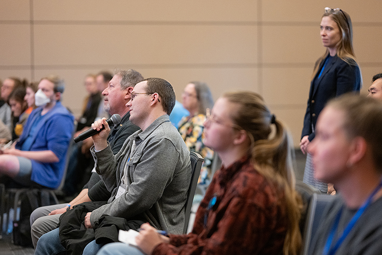 An attendee asks a question during the Q&A portion of the keynote speech at the Middle Tennessee State University Holocaust Studies Conference on March 6 in the Student Union Ballroom on the MTSU campus in Murfreesboro, Tenn. (MTSU photo by Cat Curtis Murphy)