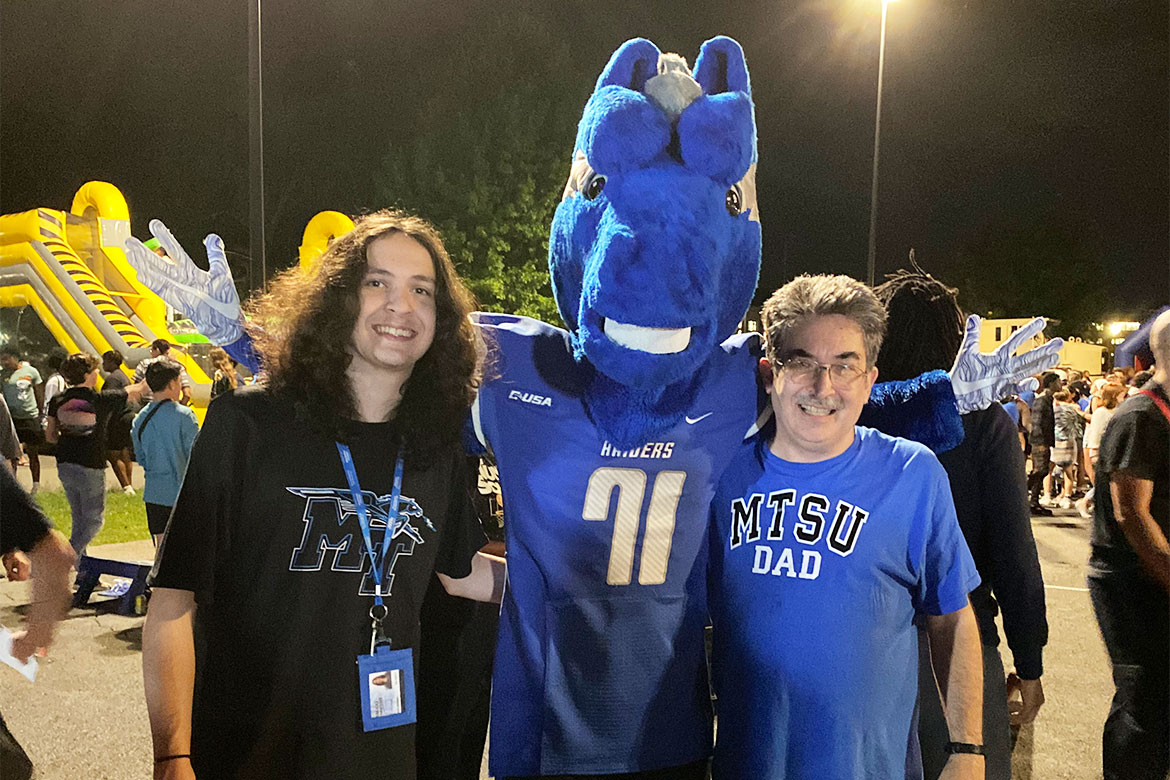 In this undated photo , College of Media and Entertainment Spring 2025 graduate Joseph Jernigan, left, poses for a photo with Middle Tennessee State University’s mascot Lightning and his father Doug Jernigan, who graduated from the university in 1991 at a campus event on the Commons. A Meridian, Mississippi, resident, Joseph took advantage of MTSU’s Academic Common Market tuition savings program to become a Blue Raider. (Photo submitted)