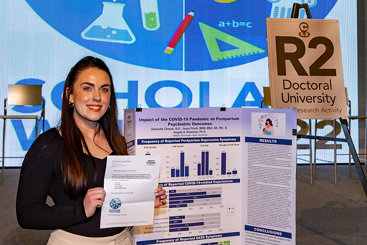 Gabrielle Chesak, Middle Tennessee State University graduate public health student, won third place for her research on the impacts of the pandemic on postpartum mental health at the university’s annual “Scholars Week” research expo on March 25, 2022, in the Student Union Building ballroom on campus. (MTSU photo by Andrew Owusu)