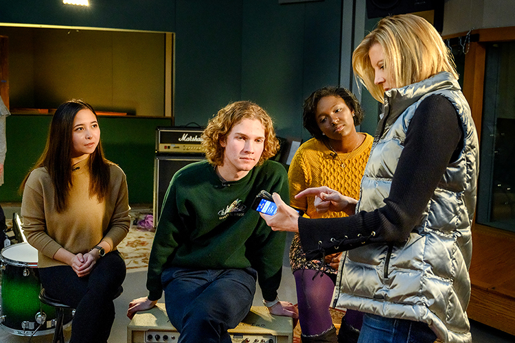 NBC Nightly News Sunday anchor Kate Snow shows MTSU recording industry students some of the video shot of their conversation in late January in one of the recording studios in the Bragg Media and Entertainment Building. From left are seniors Trianne Newbrey and Austin Sawyer, junior Micaela Griffin, and Snow. The story aired Feb. 10 before the 61st Annual Grammy Awards telecast. (MTSU photo by J. Intintoli)